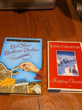 Bet Your Bottom Dollar & Skipping Christmas - Two Hardcover Books (Blue & Red)